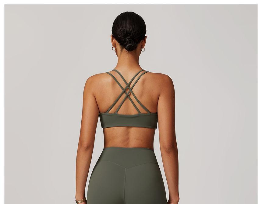 Plain Open Back Sports Bra / Long-Sleeve Off-Shoulder Crop Top / Low Rise Flared Yoga Pants / Set Product Image