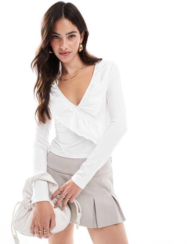 ASOS DESIGN frill wrap top with ruffle cuff in ivory Product Image