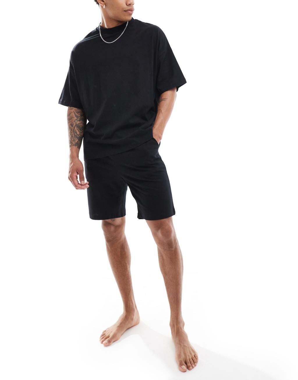 ASOS DESIGN pajama set with oversized t-shirt and shorts in jersey in black  Product Image