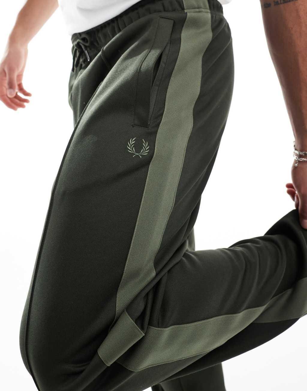 Fred Perry track sweatpants in dark green with taping - part of a set Product Image