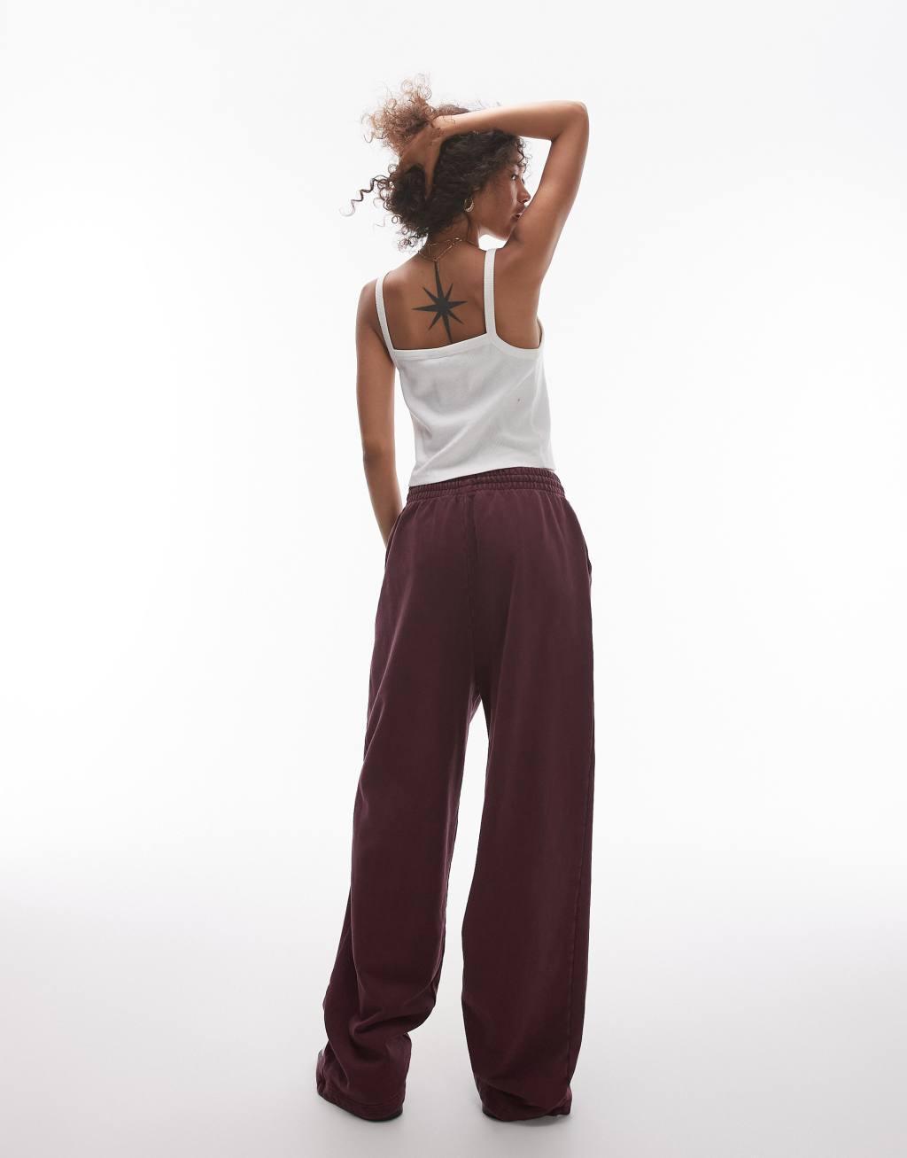 Topshop acid wash wide leg sweatpants in burgundy Product Image