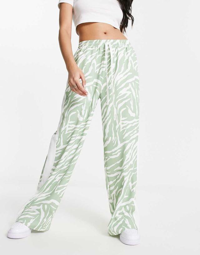 ASOS DESIGN pull on pants with contrast panel in animal print in sage  Product Image