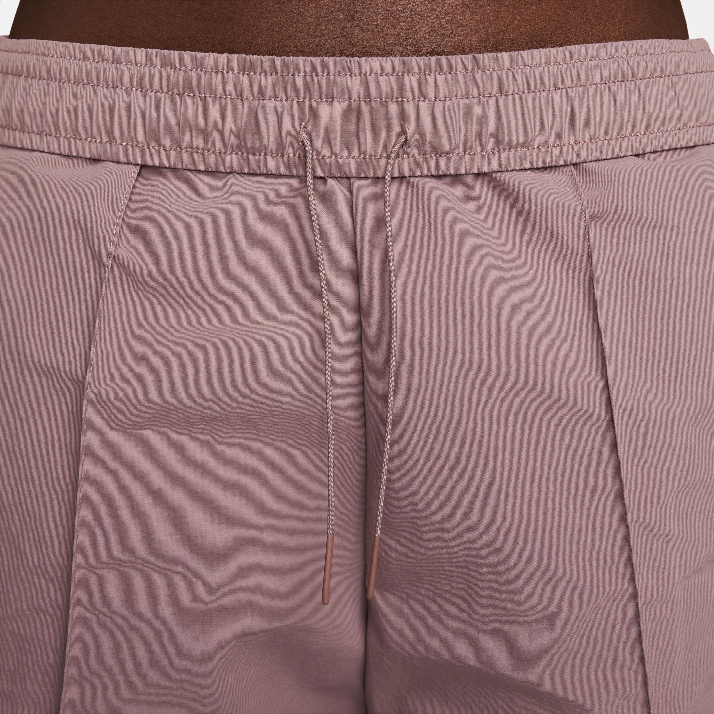 Nike Trend woven baggy parachute pants in smokey mauve Product Image