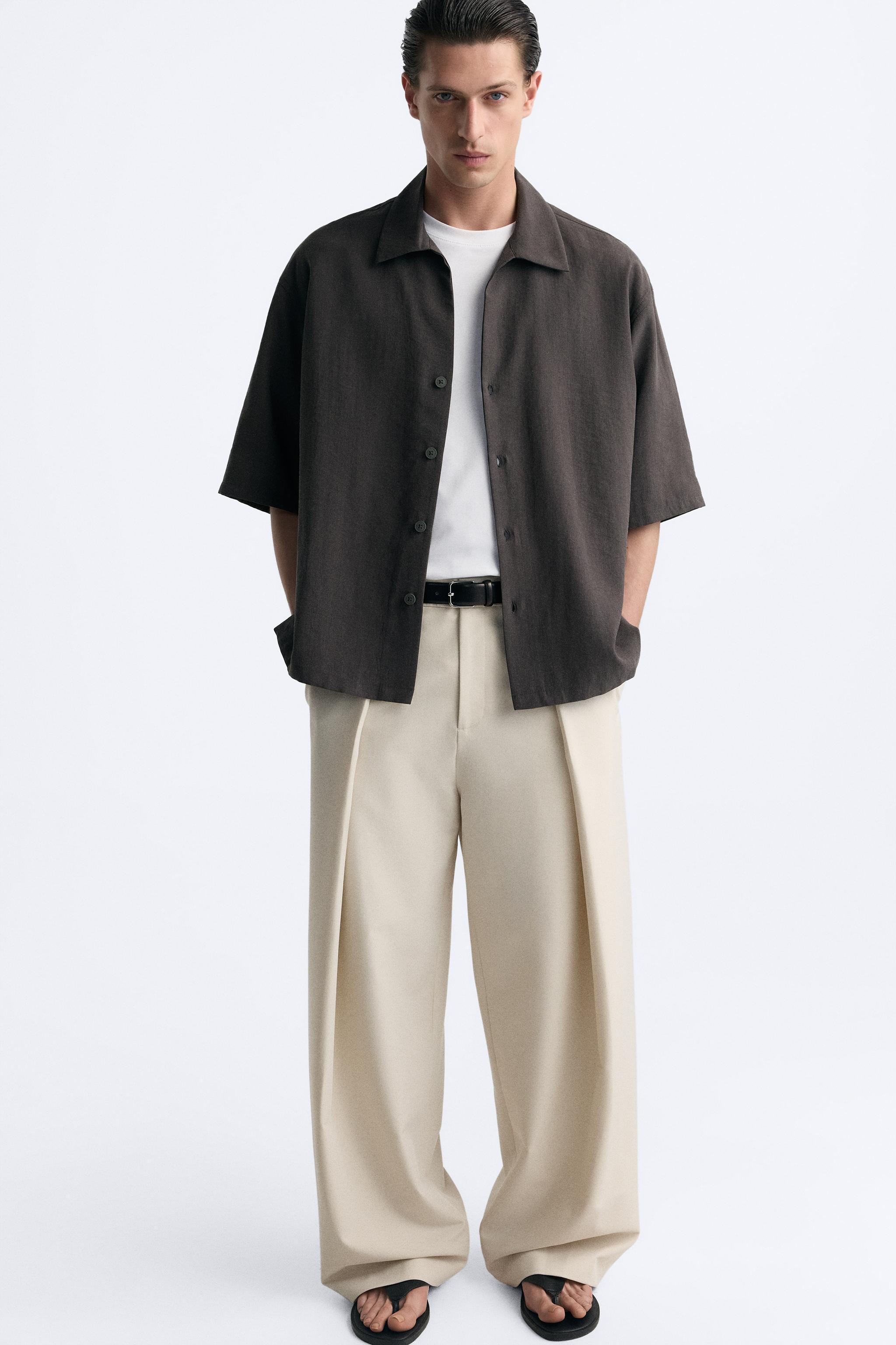 PLEATED WIDE FIT PANTS Product Image