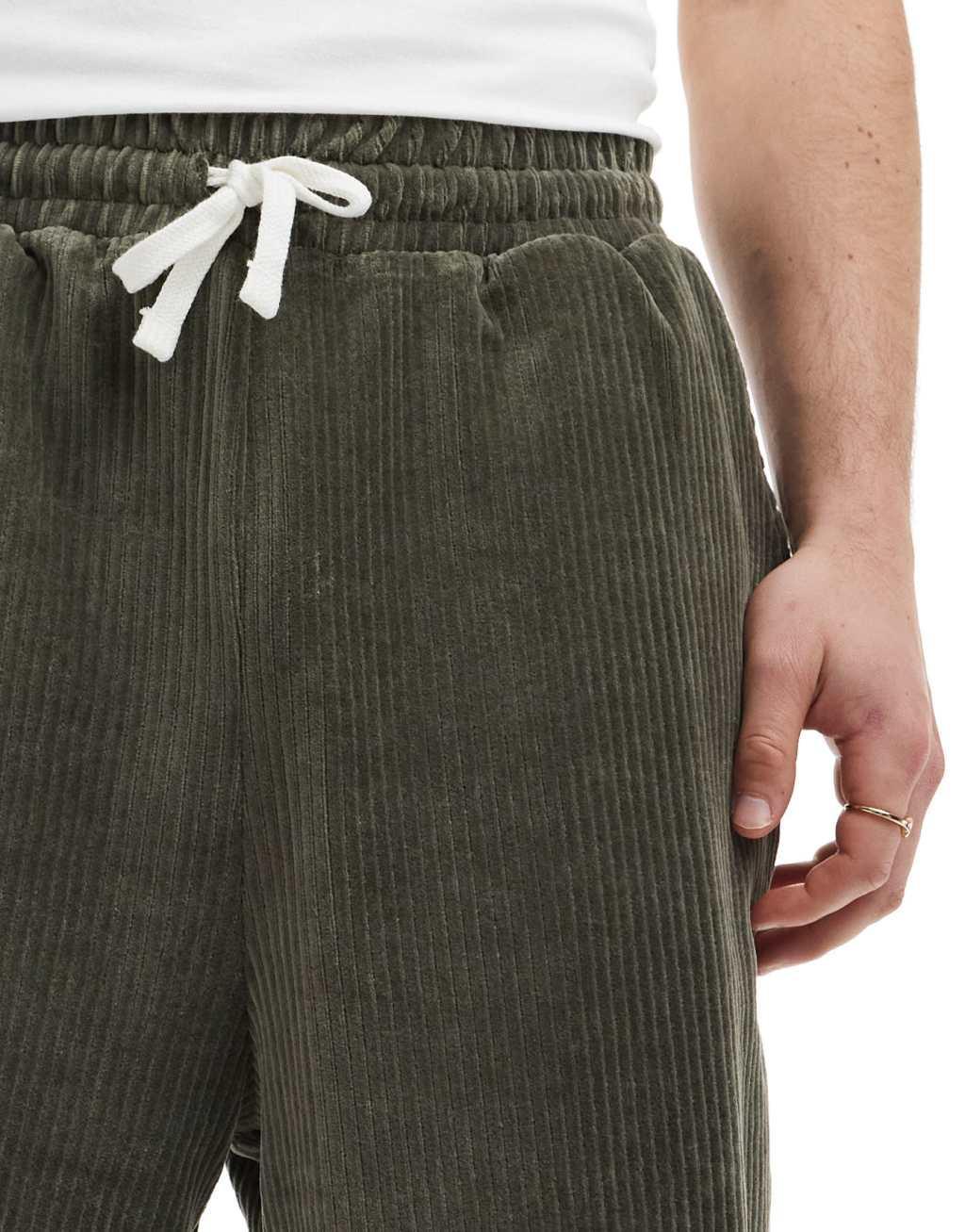 ASOS DESIGN oversized ribbed velour shorts in dark green Product Image