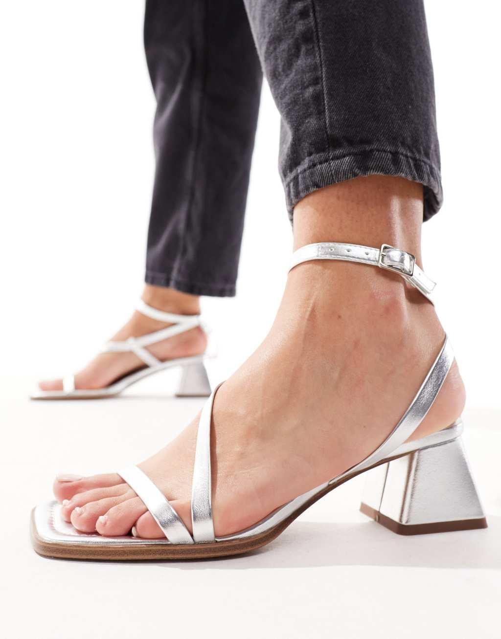 ASOS DESIGN Hibiscus asymmetric mid block heeled sandals in silver Product Image