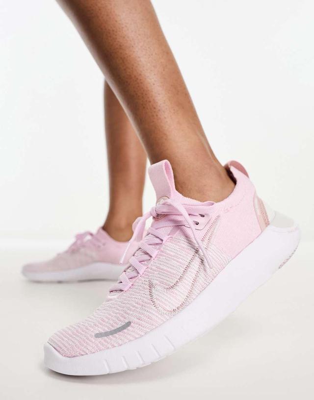 Nike Free Run Flyknit sneakers in pink Product Image