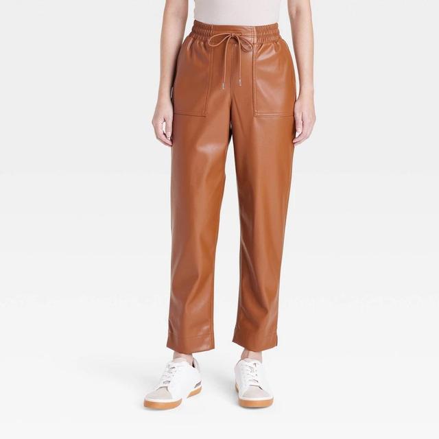 Womens High-Rise Faux Leather Tapered Ankle Pull-On Pants - A New Day Tan XS Product Image