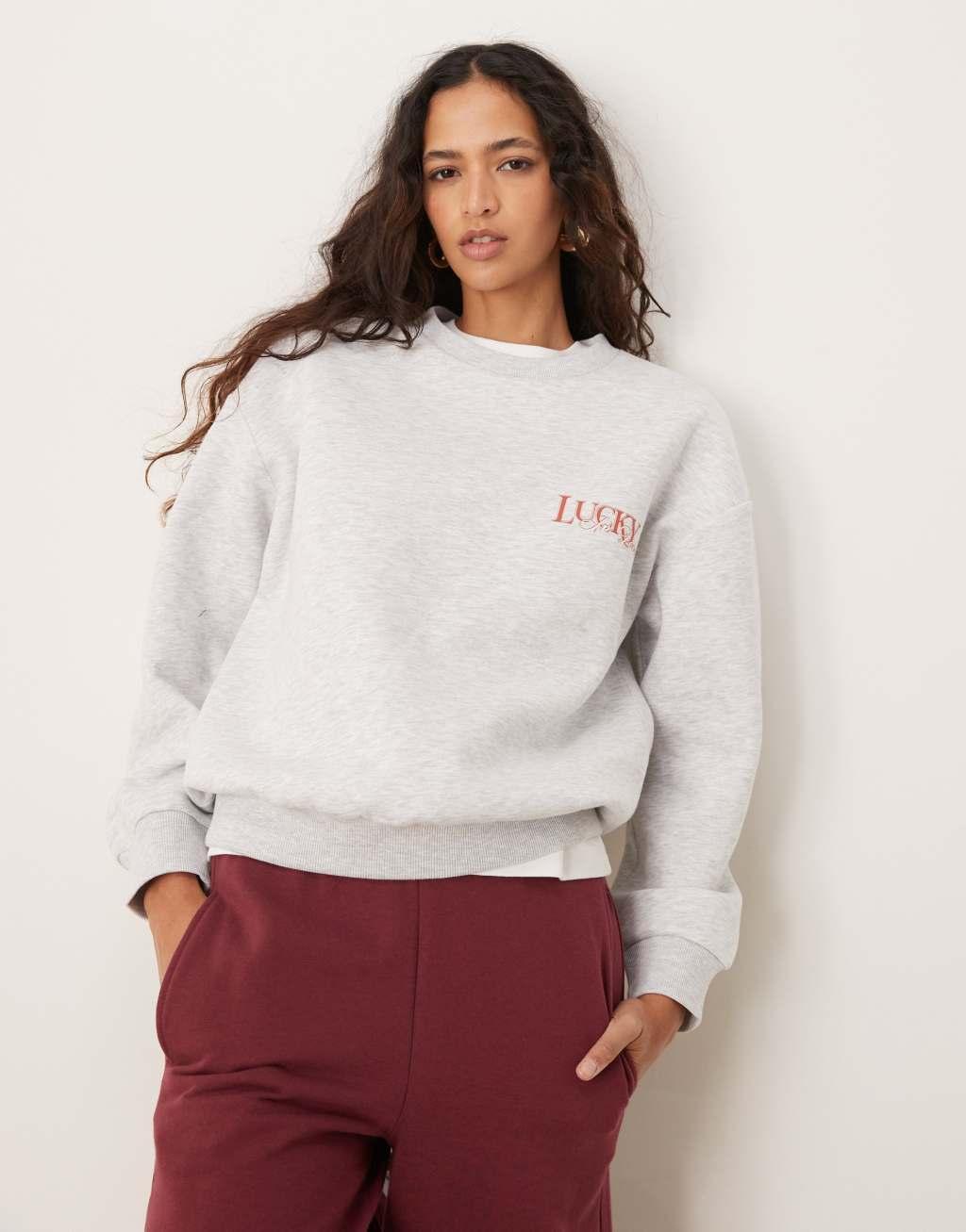 ASOS DESIGN oversized sweatshirt with lucky in love cherub graphic in heather gray Product Image