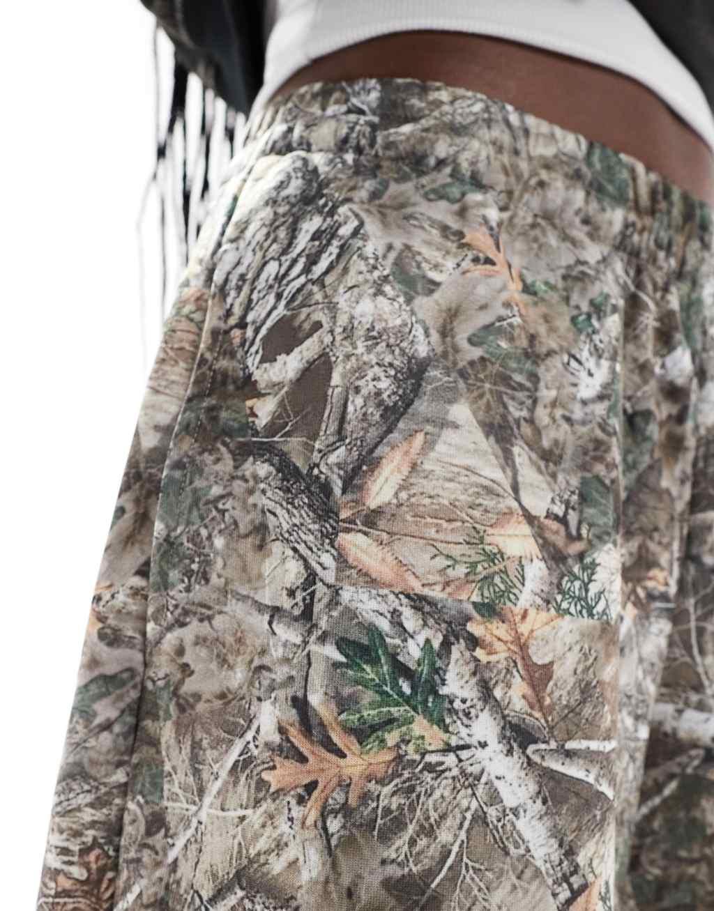 COLLUSION relaxed long sweat shorts in woodland camo Product Image