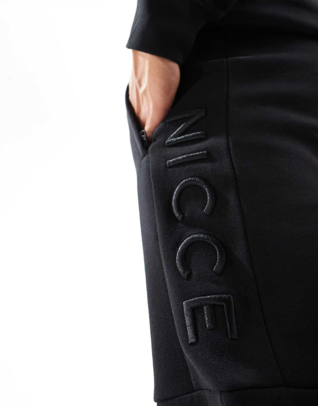 Nicce logo sweatpants in black Product Image