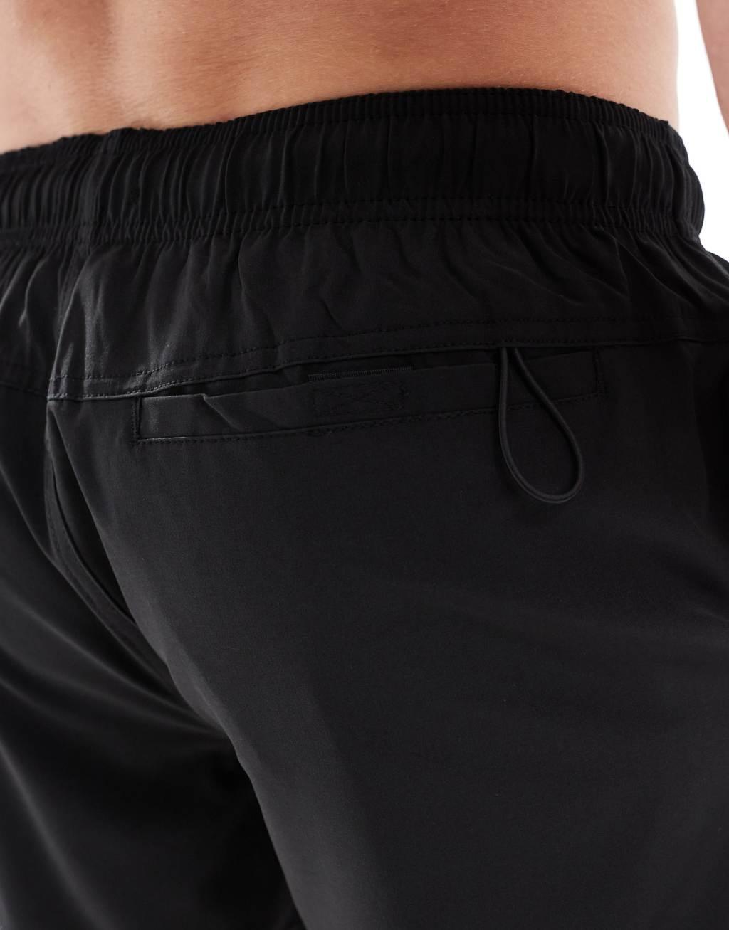 Cotton On stretch swim shorts in black Product Image