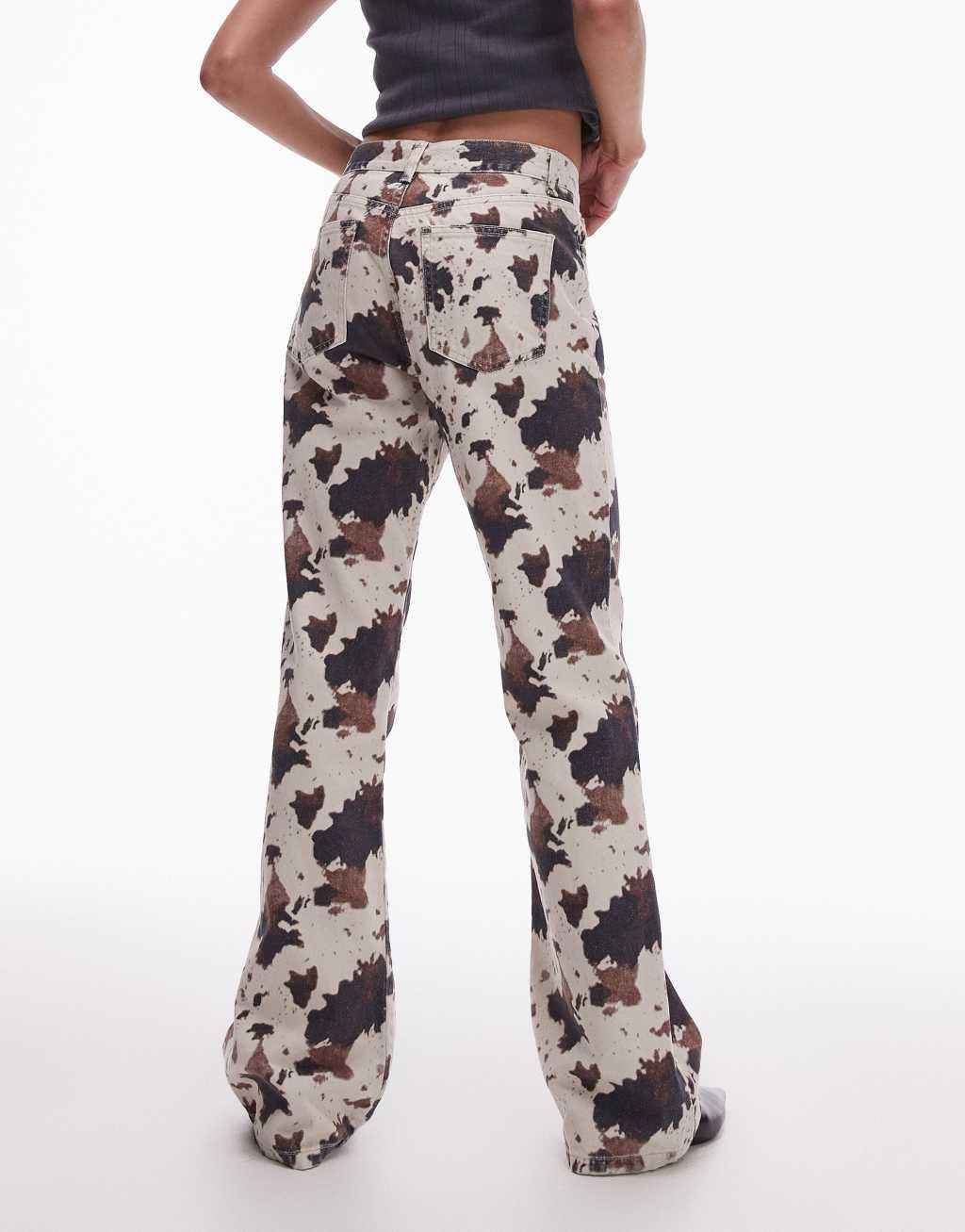 Topshop mid rise 90s flare jeans in cow print Product Image