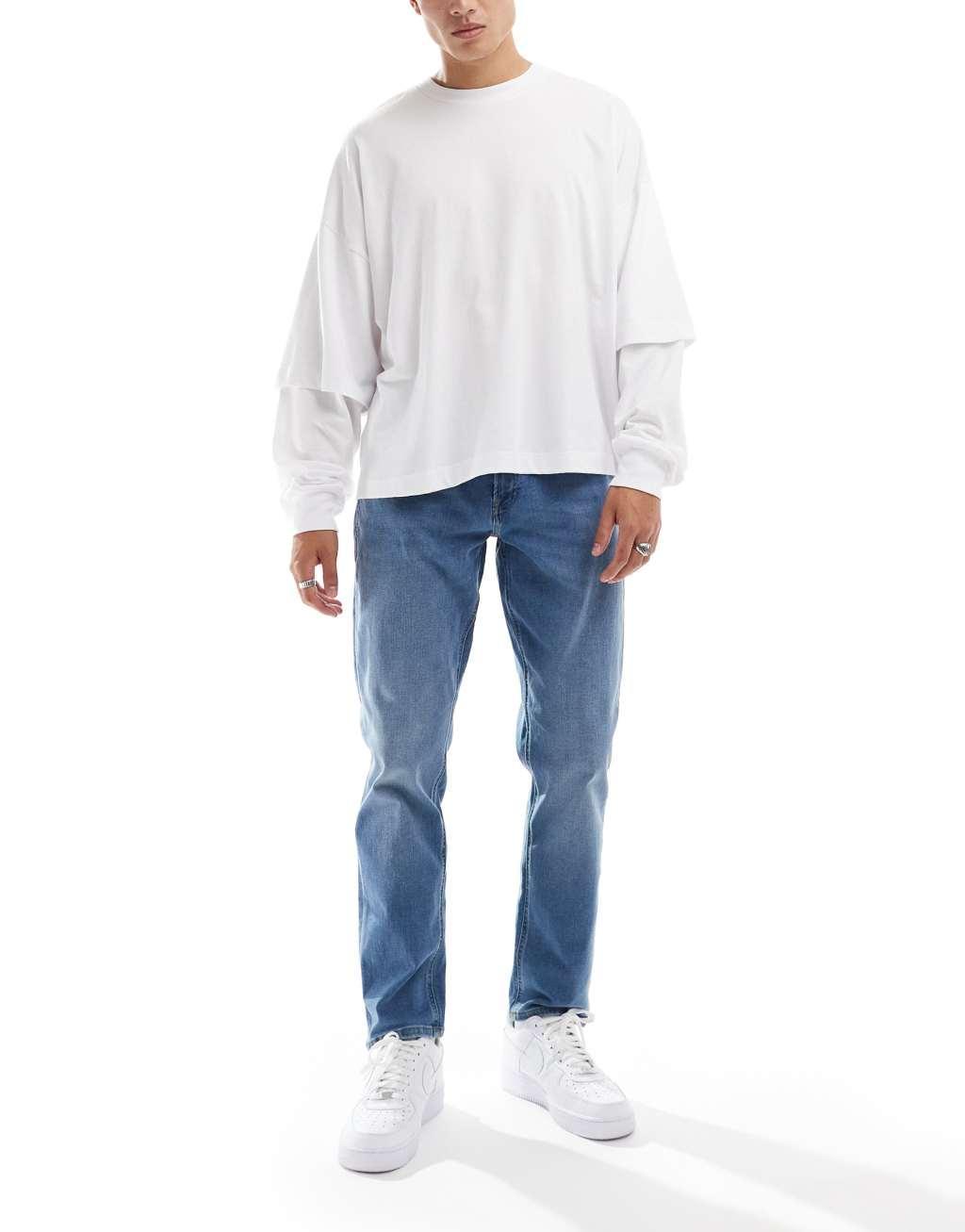 JJ Rebel adam tapered jeans in mid blue wash  product image