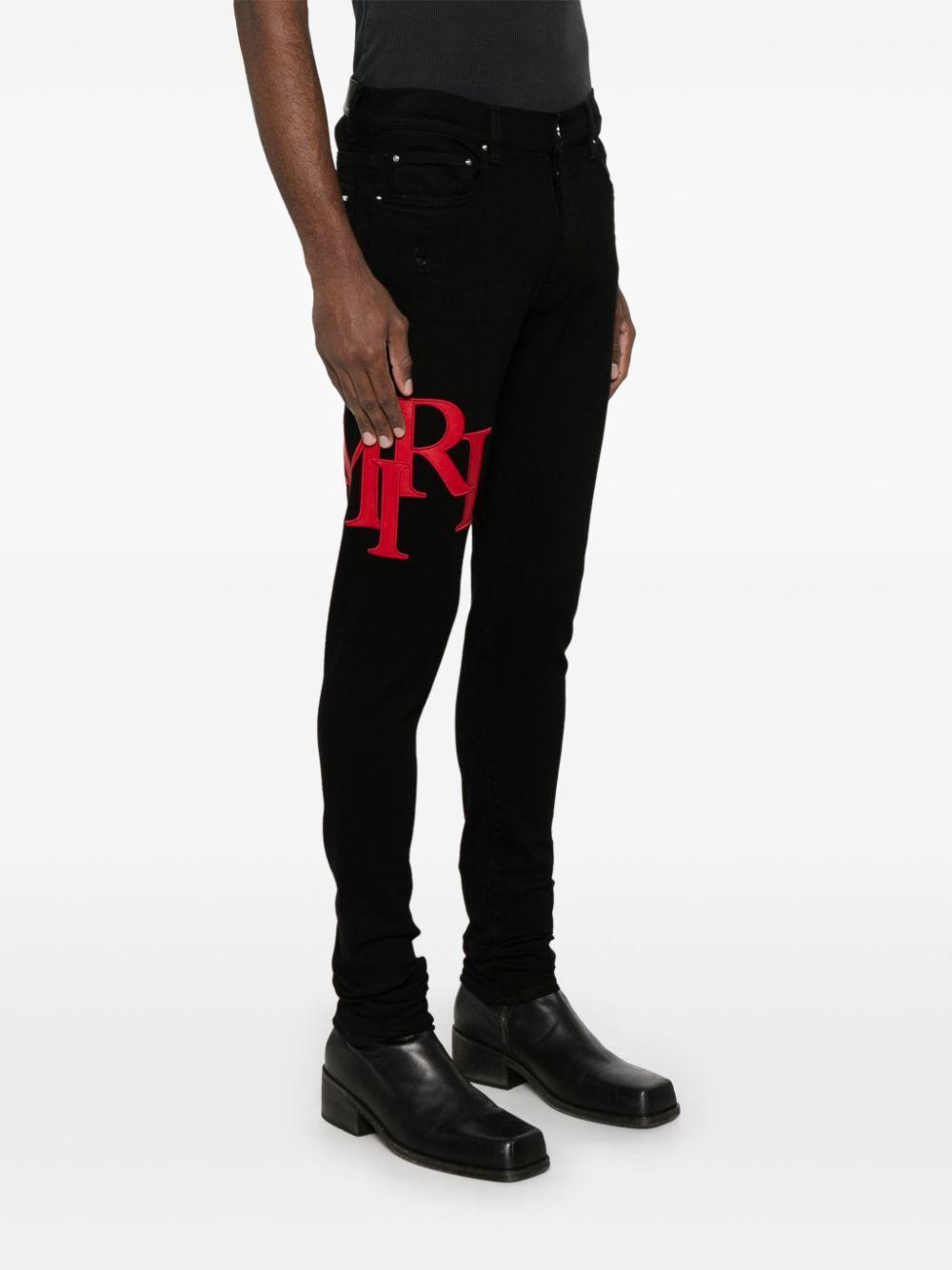 Staggered-logo-embroidered jeans Product Image