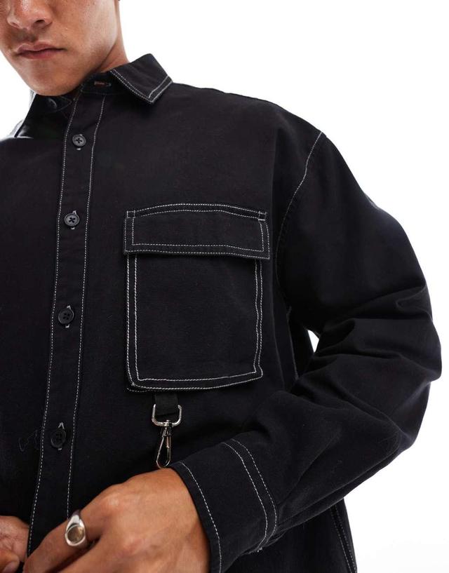 ASOS DESIGN 90s oversized shirt with contrast stitching and metal detail in black Product Image