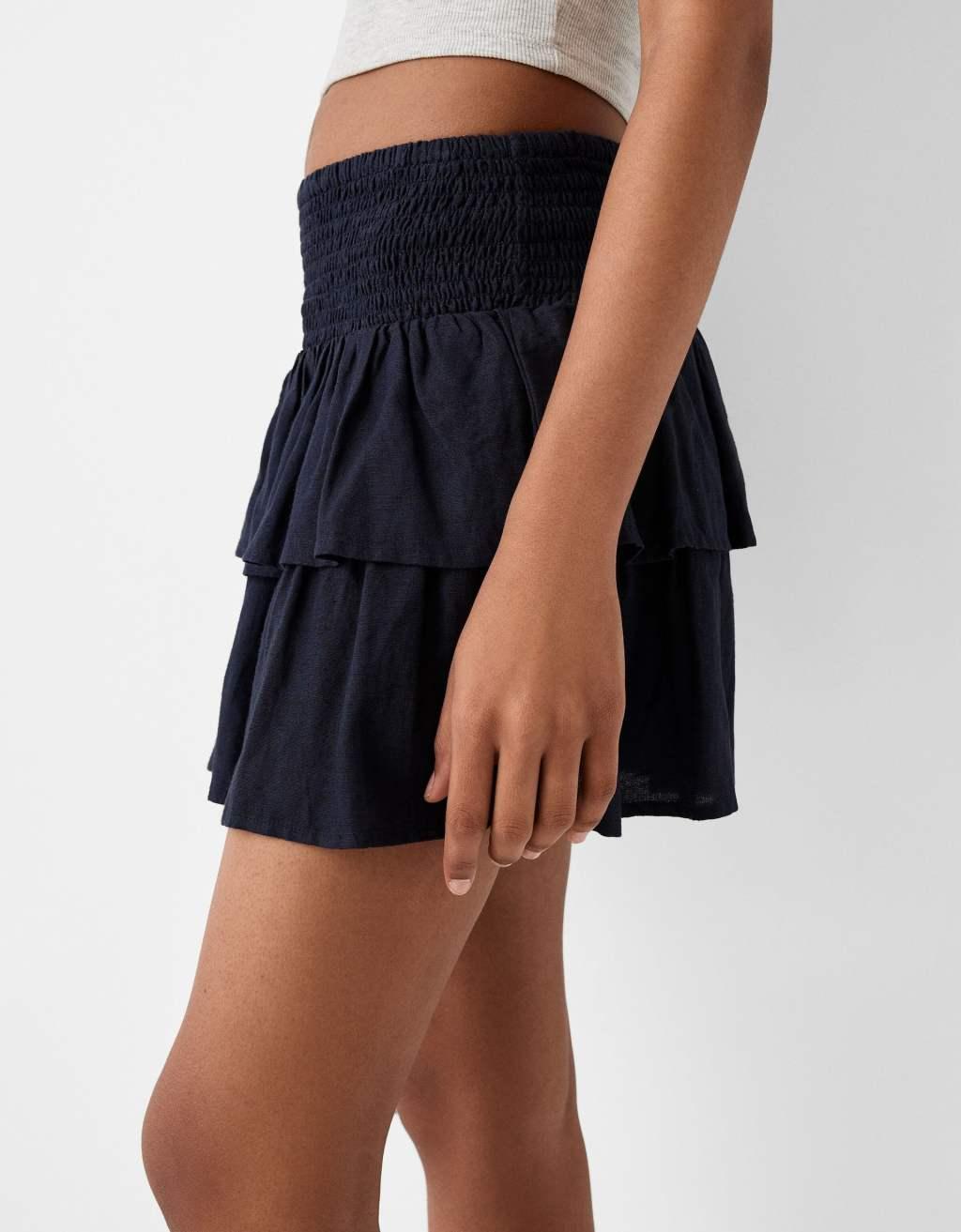 Bershka shirred waist rara mini skirt in navy Product Image