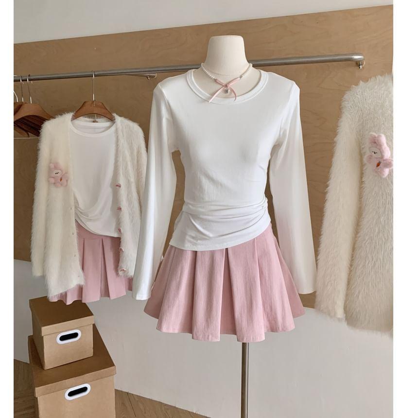 Set: V-Neck Cartoon Detail Bow Button Cardigan + Long Sleeve Crew Neck Plain Tee + High Rise Plain Pleated Mini A-Line Skirt Product Image