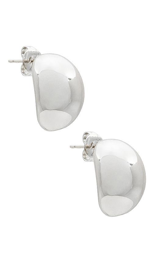 SHASHI X Revolve Crescent Hoops in Metallic Silver. Product Image