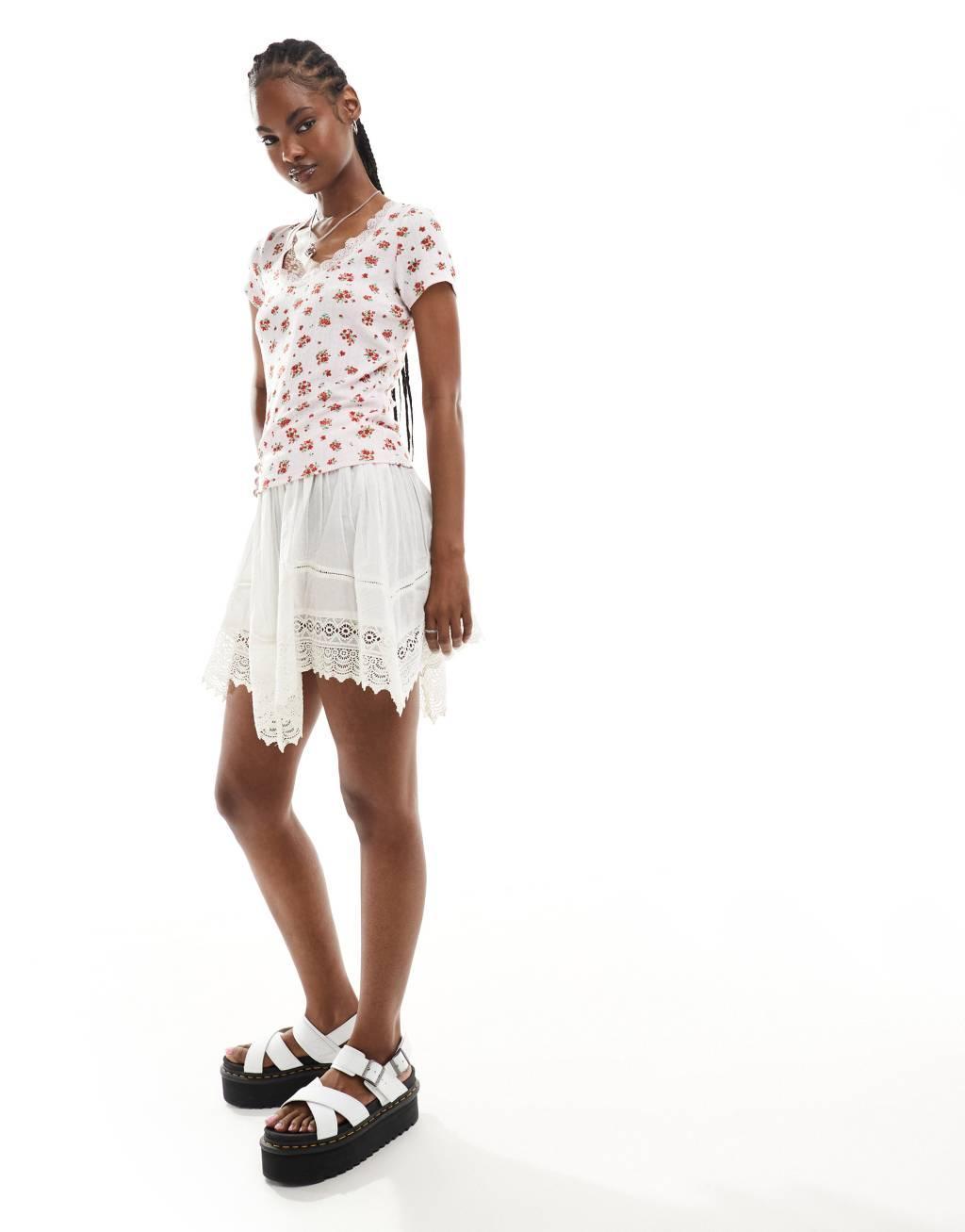 Monki pointelle top with scoop neck and lace trim in pink and red floral print Product Image