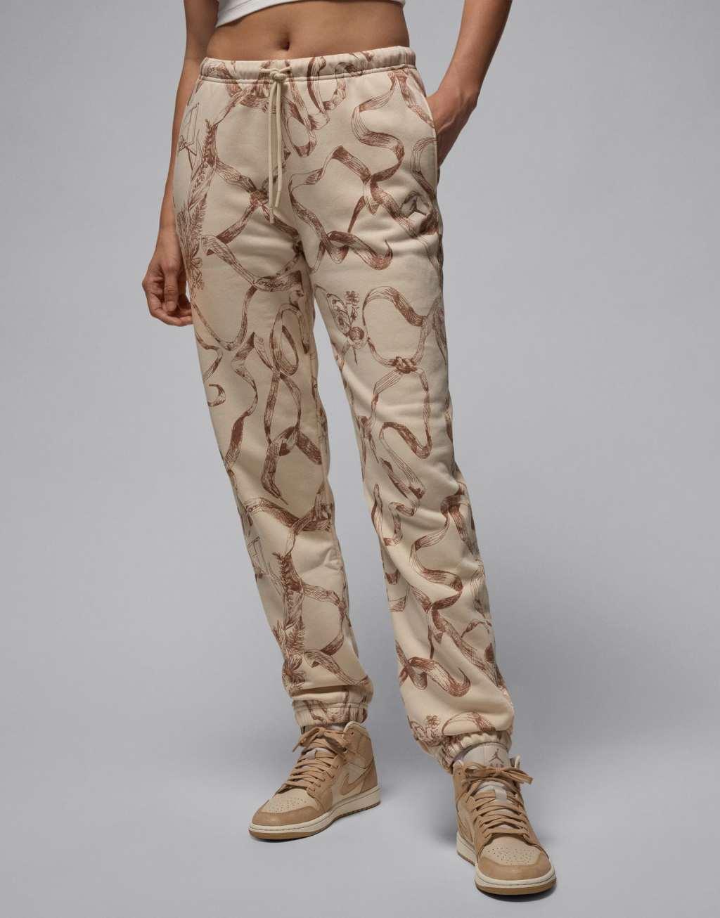 Jordan Brooklyn fleece all-over print sweatpants in brown Product Image