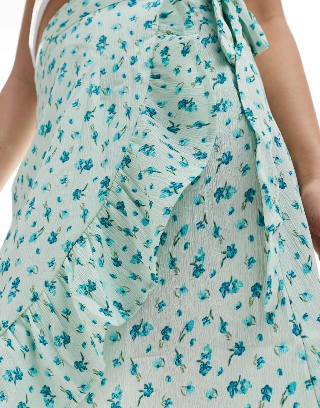 Vero Moda wrap front midi skirt in light blue floral Product Image