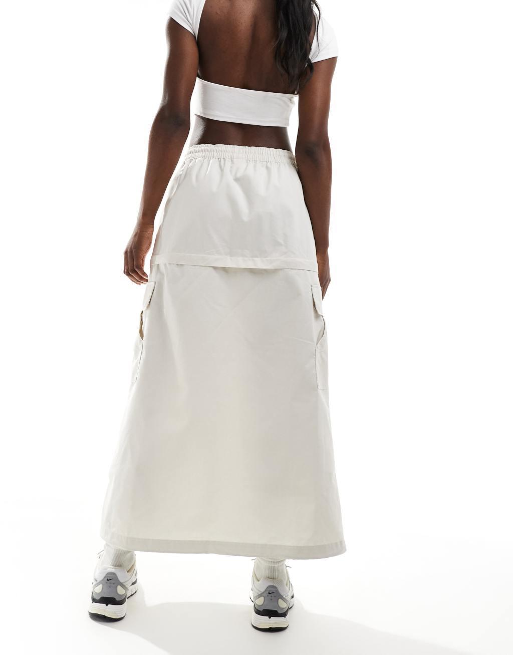 Nike Woven 2 n 1 maxi and mini skirt with zip detail in beige Product Image