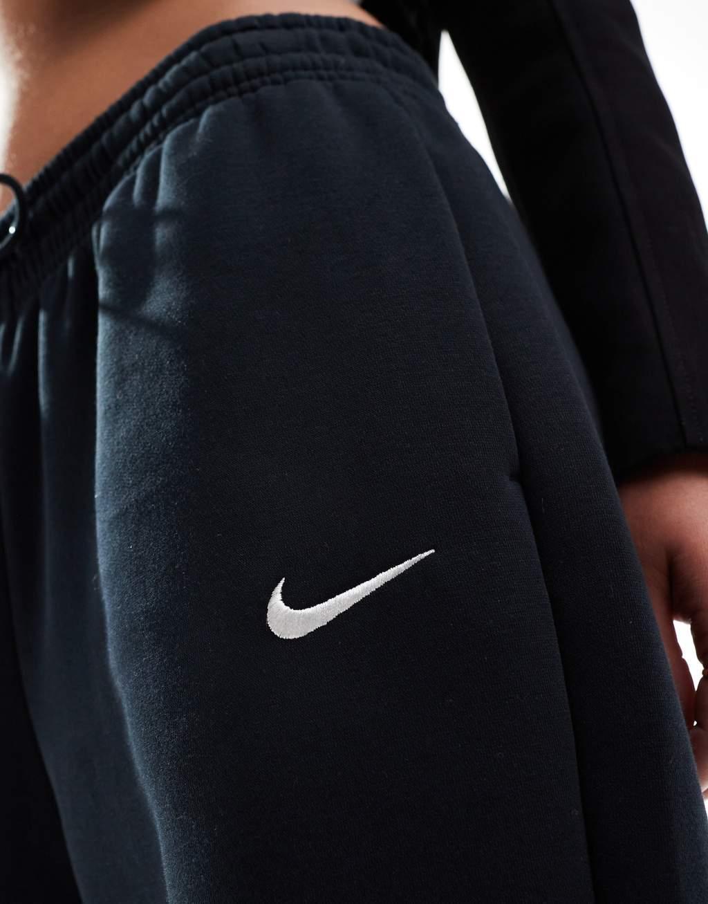 Nike Mini Swoosh sweatpants in black  Product Image