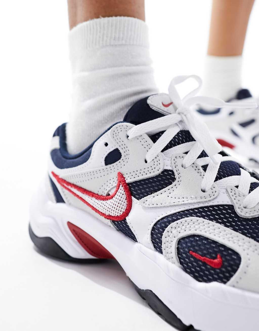 Nike Runninspo sneakers in black and white with red detail  Product Image