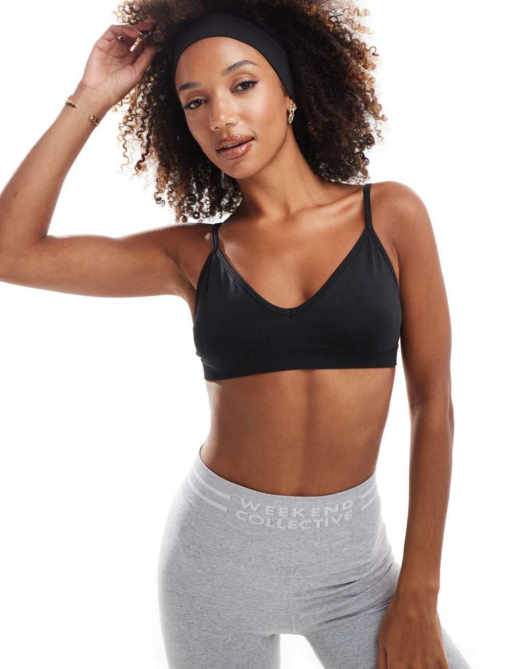 ASOS 4505 Icon seamless active intimate light support sports bra in black Product Image