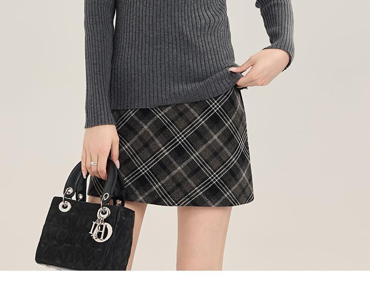 Long-Sleeve Halter Neck Plain Knit Top / High Rise Plaid Mini Skirt Product Image