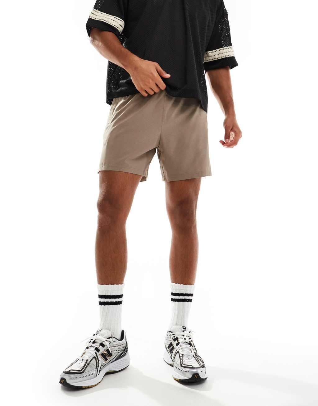 ASOS 4505 ripstop running shorts with zip side pockets in taupe gray Product Image