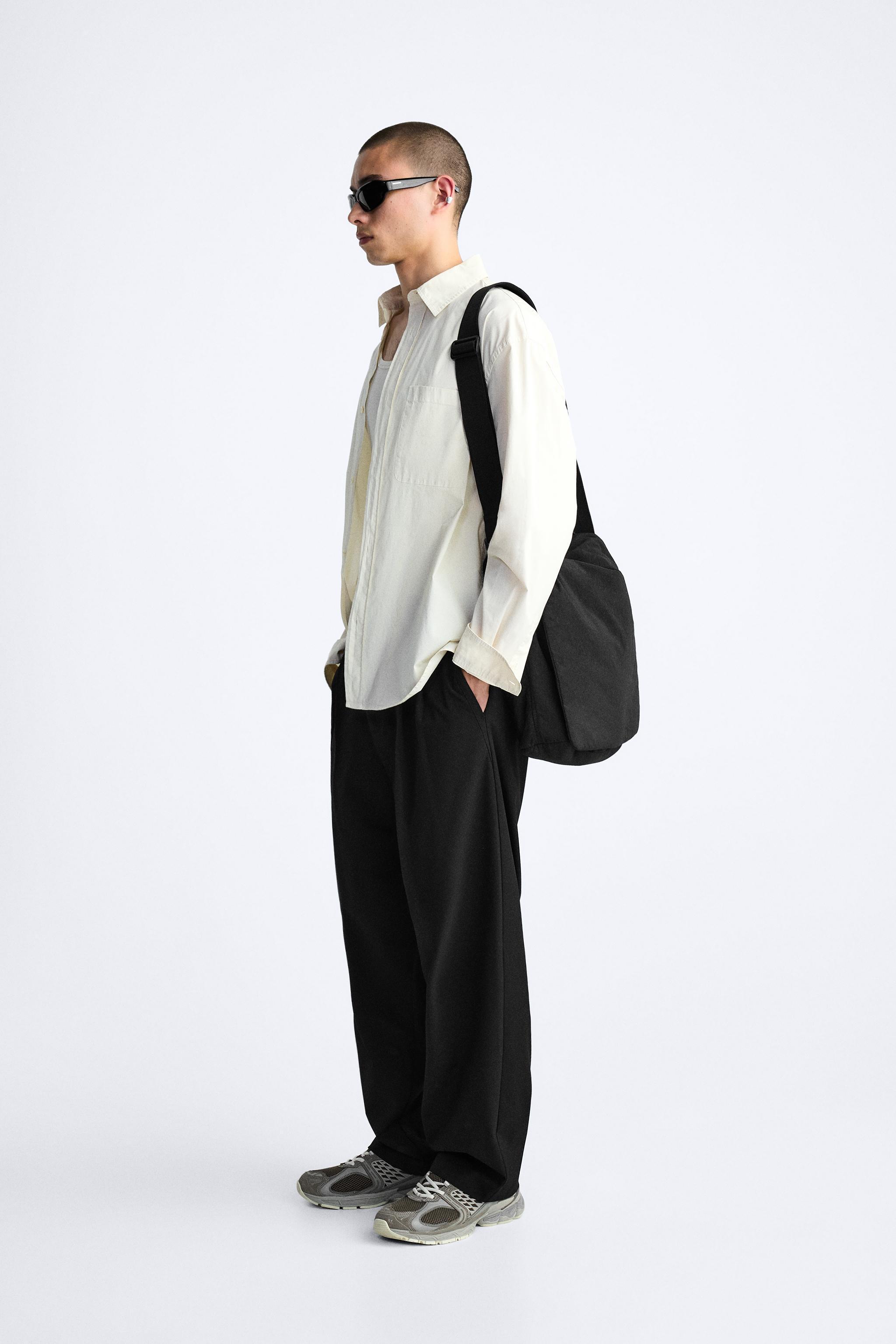 PLEATED WIDE FIT PANTS Product Image