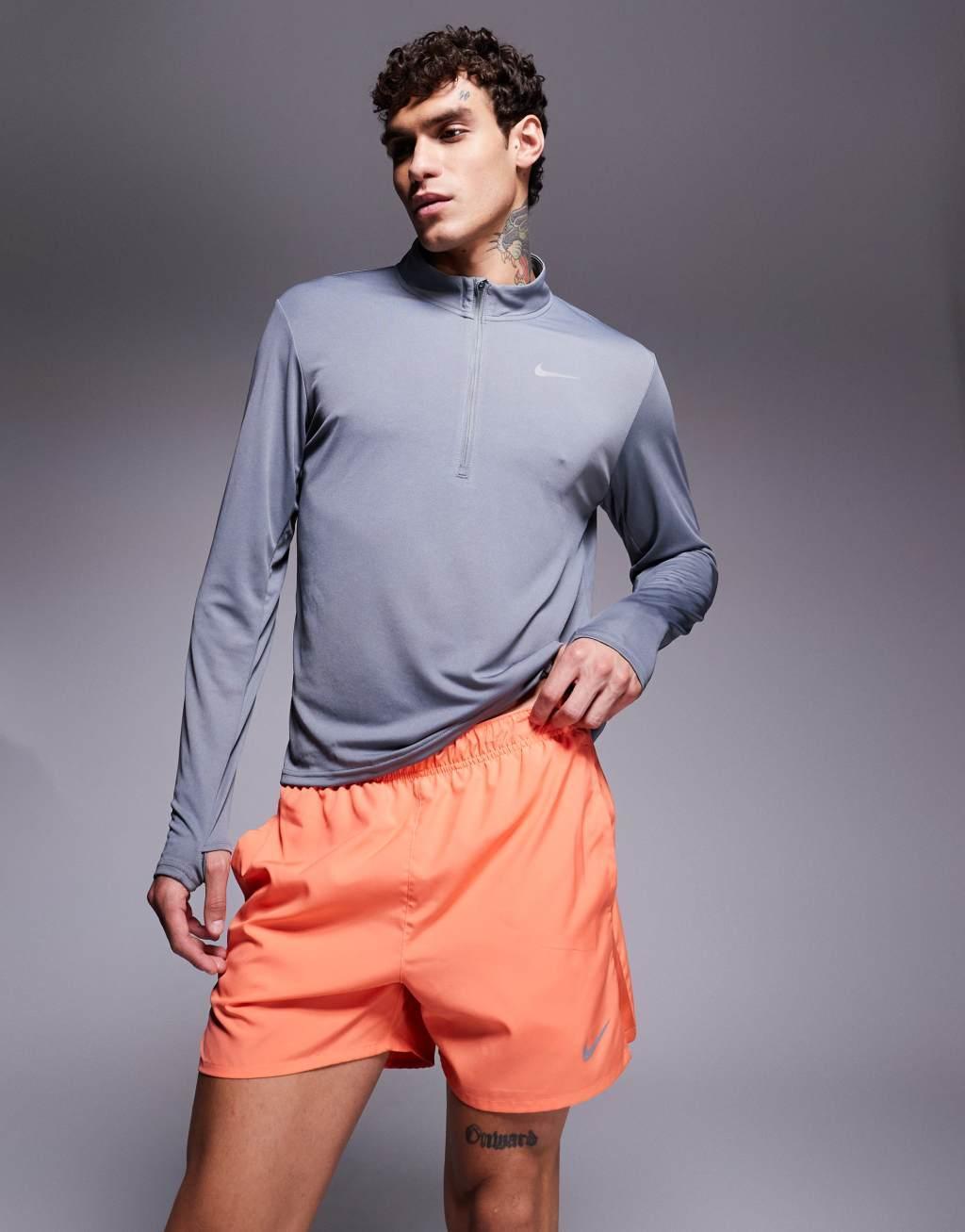 Nike Running Challenger Dri-FIT 5 inch shorts in orange Product Image