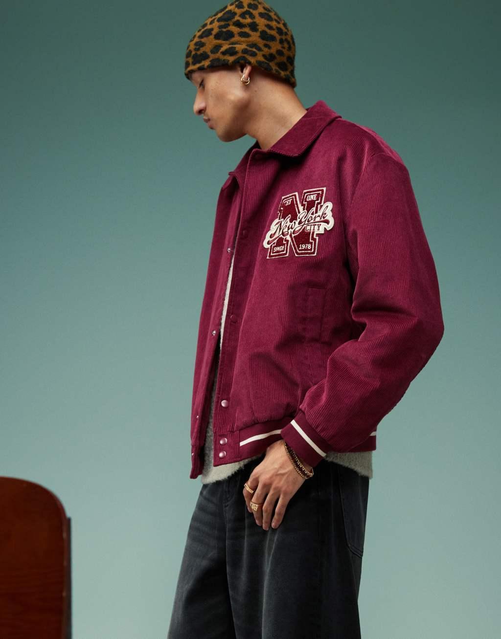 ASOS DESIGN oversized corduroy varsity jacket in burgundy Product Image